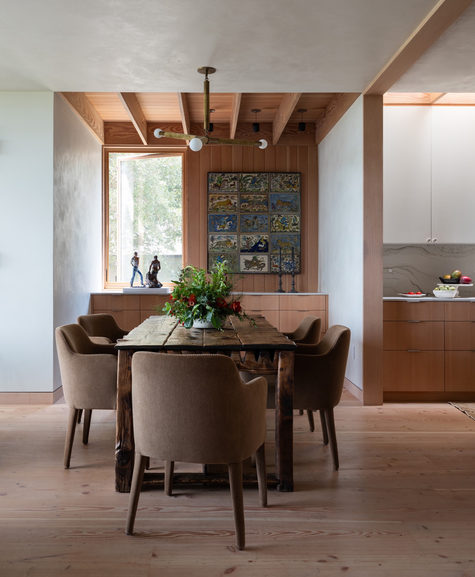 Hillside House dining room with exposed beams in West Lake Hills, Texas
